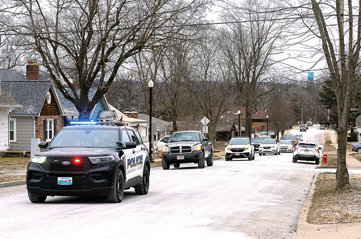 Crystal City Police lead a parade of vehicles through Crystal City to Crystal City High School for the ceremony.